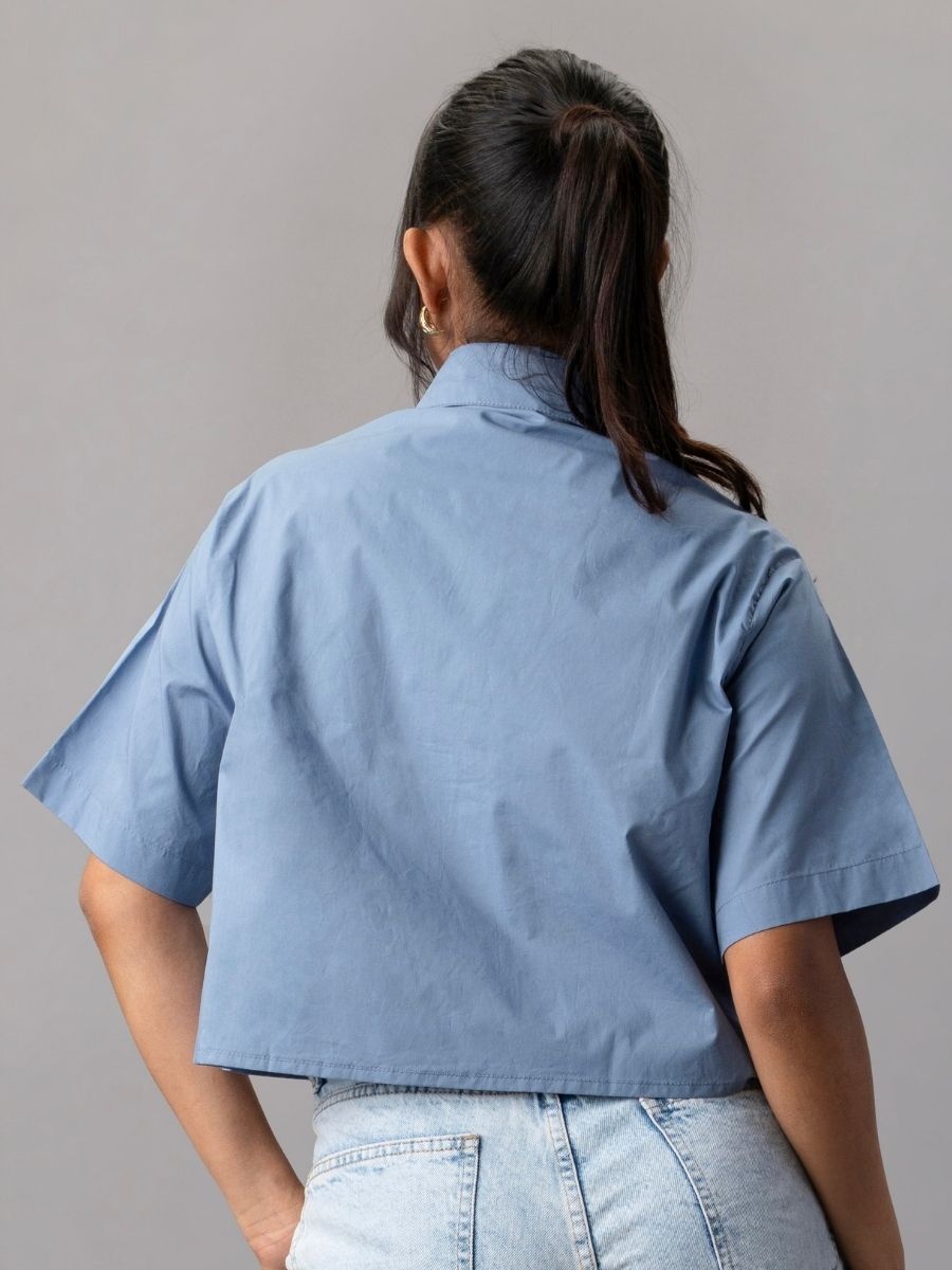 Blue Cropped Shirt with Oversized White Appliqué Flower